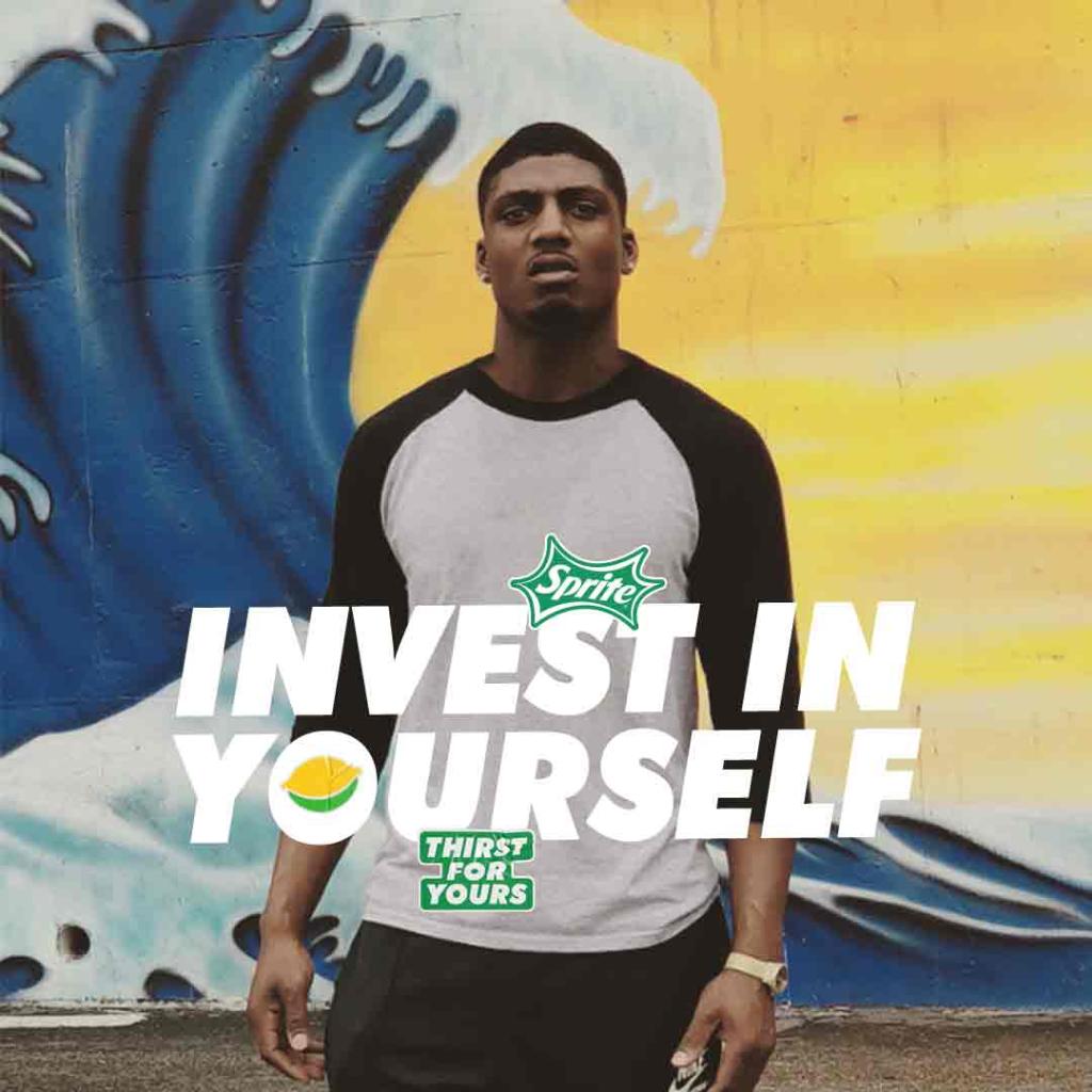 music artist in front of wave with text 'invest in yourself'