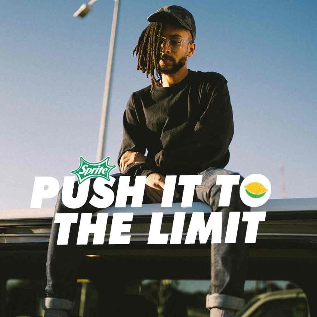 music artist sitting down with text 'push it to the limit'